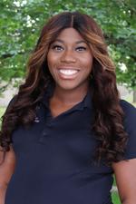 A professional headshot of Sharise Lucas-Perry in a black Oakland University shirt.